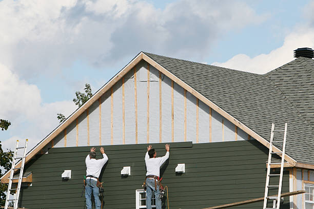 Professional Vinyl Siding technician working in Marshall, IL